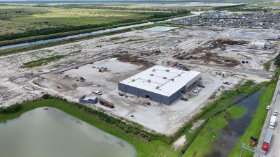 Aerial view of a construction site with a large building.