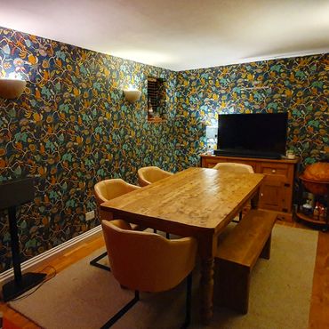 Fun a vibrant wallpaper in a dining room with monkeys and fruit