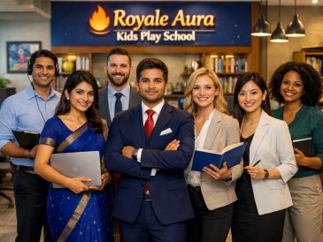 Diverse professional team posing at Royale Aura Kids Play School.