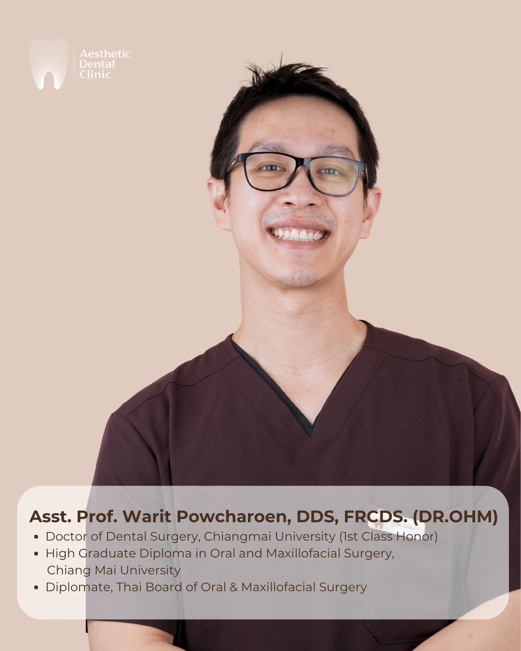 Portrait of Asst. Prof. Warit Powcharoen, dental surgeon, smiling in clinic attire.