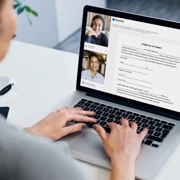 Person signs a Power of Attorney document online with a notary via video call.