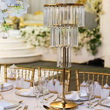 Elegant gold and crystal centerpiece on a formal dining table.