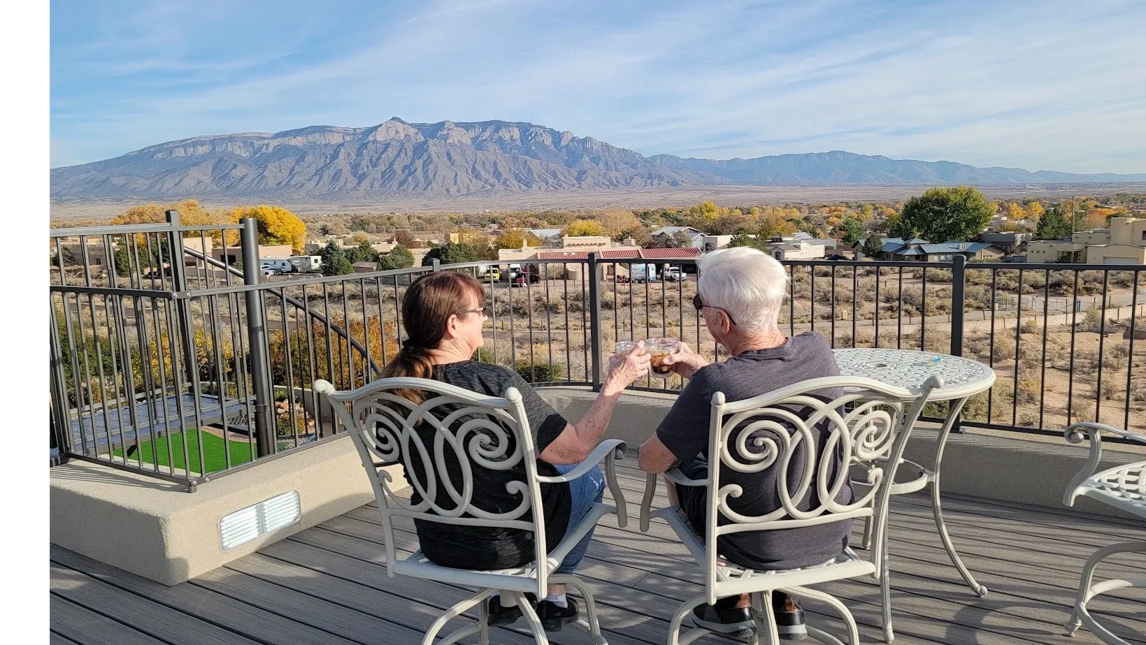 Happy customers on their deck built by smart homes.