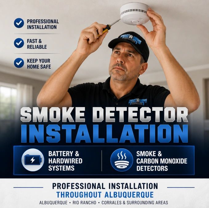 Smart Home Services technician installing a smoke detector in an Albuquerque home.