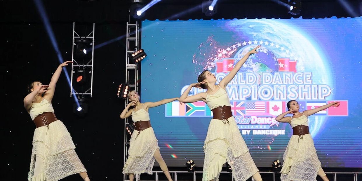 Four dancers performing at the World Dance Championship.