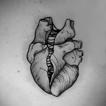 Image of a realistic heart black and grey tattoo
