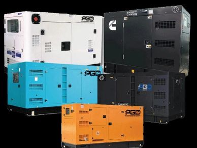 A group of colorful industrial generators against a black background.