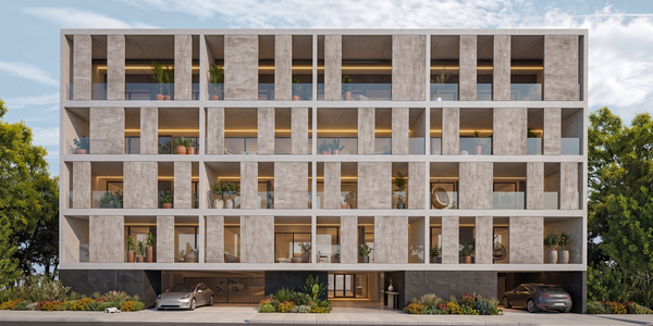 Modern apartment building with geometric balconies and greenery.
