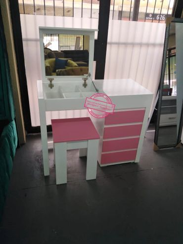 dressing table with pink drawers