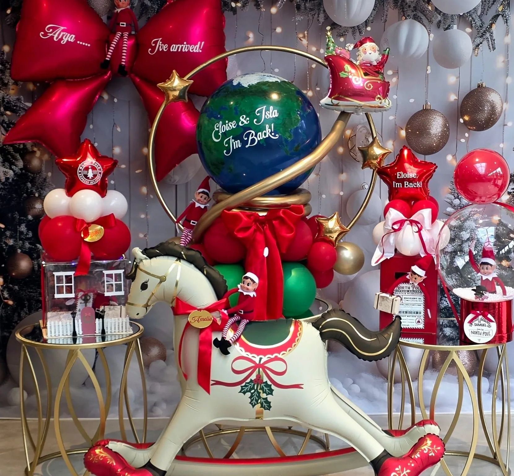 Festive Christmas decorations with elves and balloons.