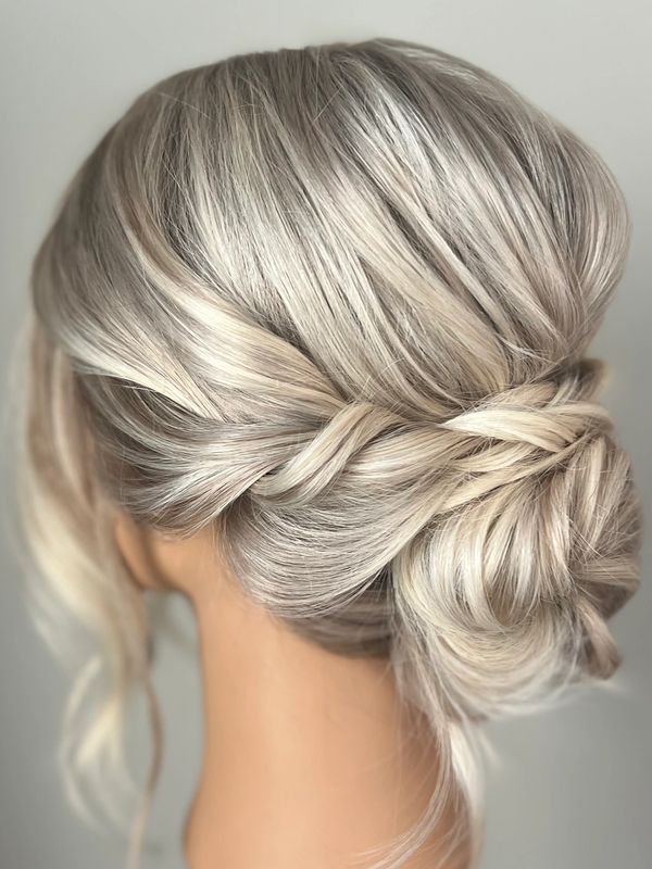 Blonde updo low bun bridesmaid 
