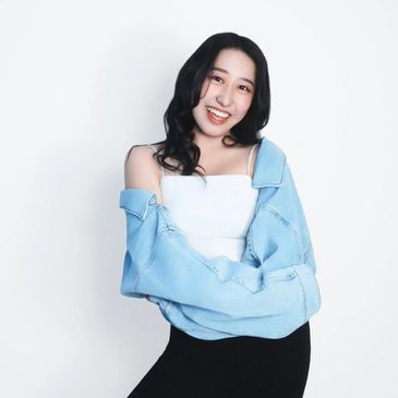 K-pop and Hip Hop dance instructor in studio with confident, focused presence