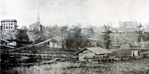 historic photo of downtown McMinnville,TN with Southern Blue visible on the skyline.
