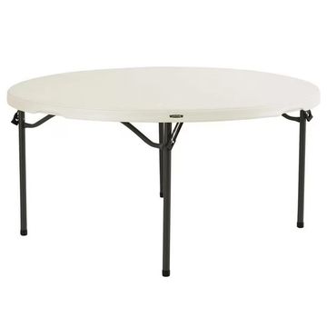 Round folding table with white top and black legs.