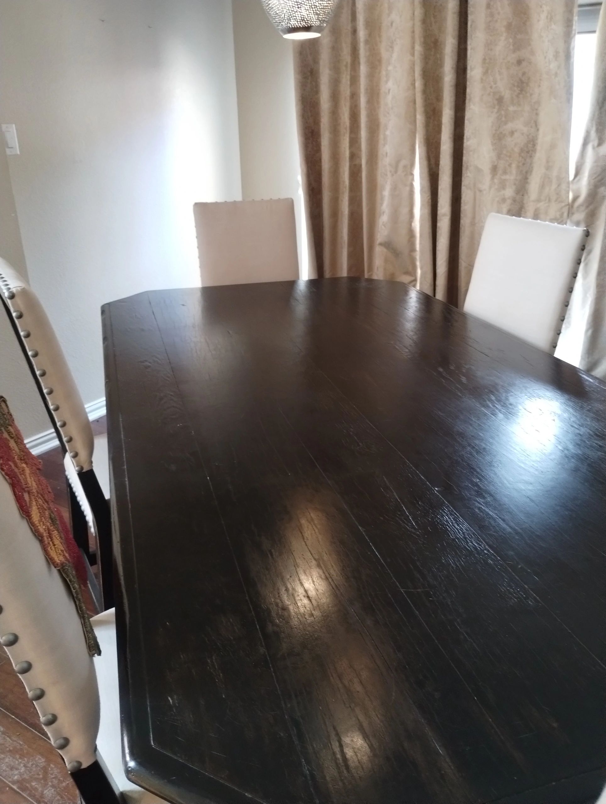 Dark wood dining table with 6 fabric covered chairs