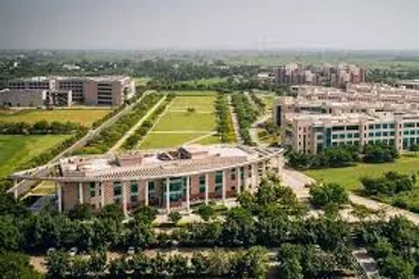 Aerial view of a modern campus with multiple buildings and green spaces.
