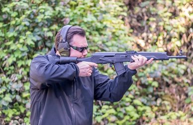 Glenn Davis firing a Saiga rifle.