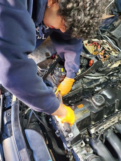 E.T. Service - Technician performing vehicle repair