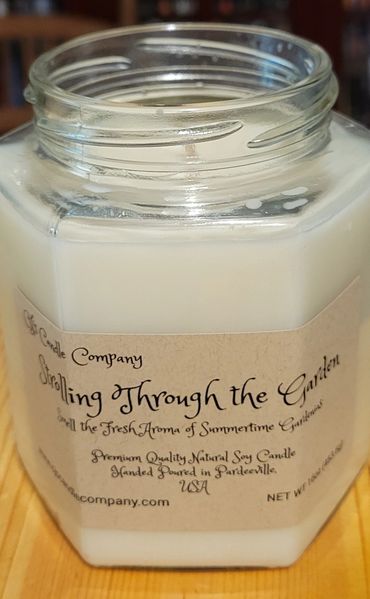 This is a 16oz Hexagon Soy Candle scented with Gardenias  named Strolling throw the garden