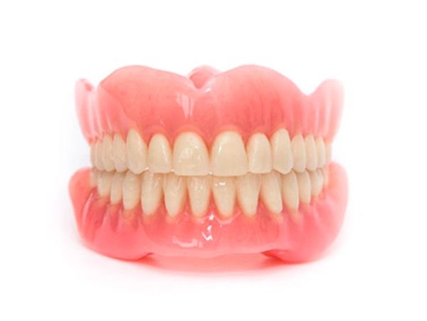 A complete set of dentures is shown and  can be used to replace lost or removed natural teeth.