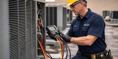 Technician inspecting HVAC unit with diagnostic tools outdoors.