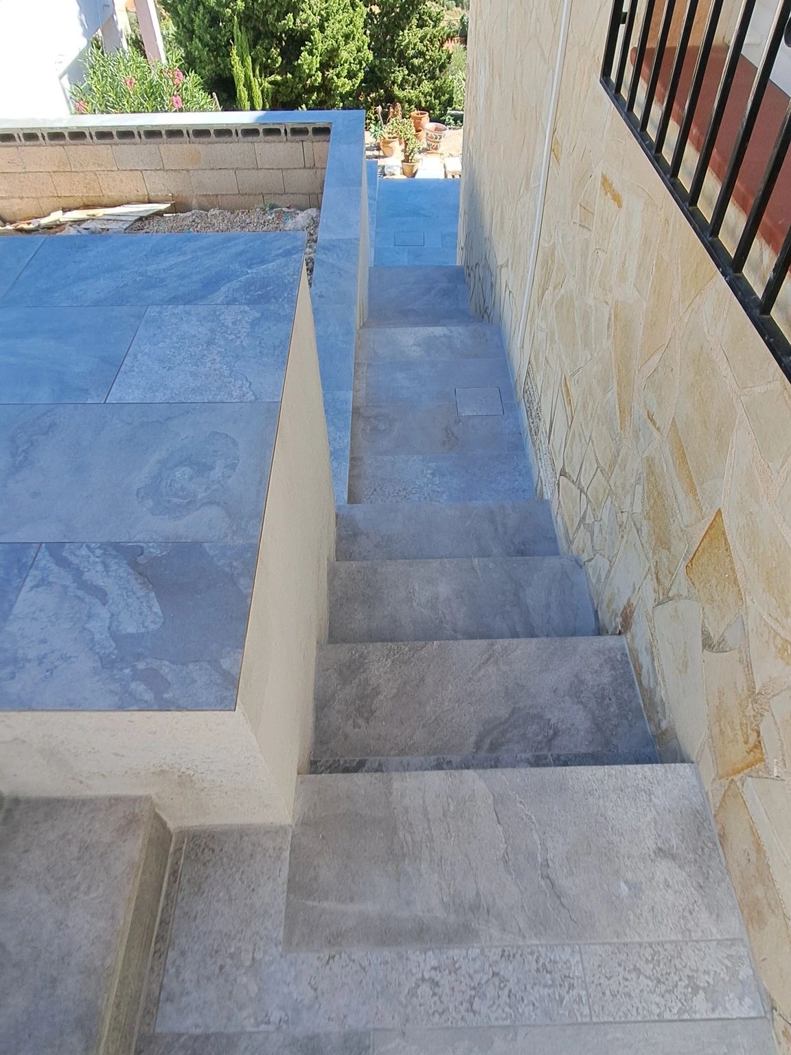 Newly formed walls, stair and terrace tiling & rendering 