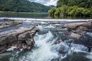 Kayaks running Kanawha Falls in West Virginia.