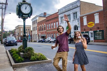 A young couple crosses the street in downtown Fayetteville, WV.