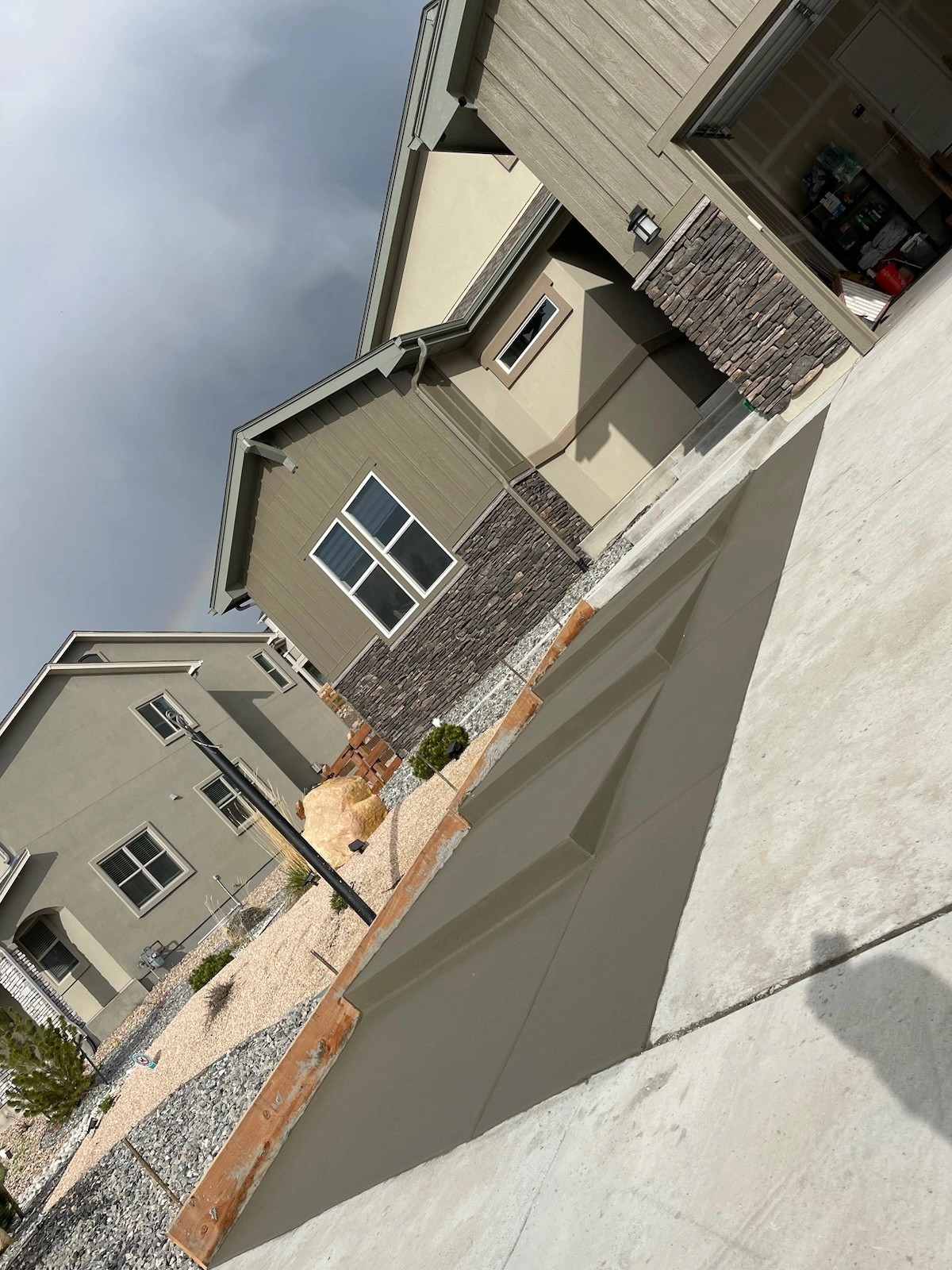 Concrete flatwork alongside residential homes