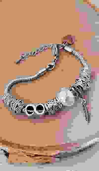 Diana...
charm bracelet, stainless steel silver snake chain with 8 beautiful charms