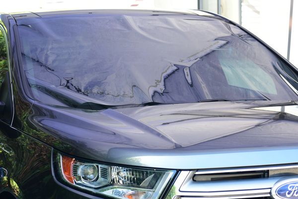 Auto window tinting in process