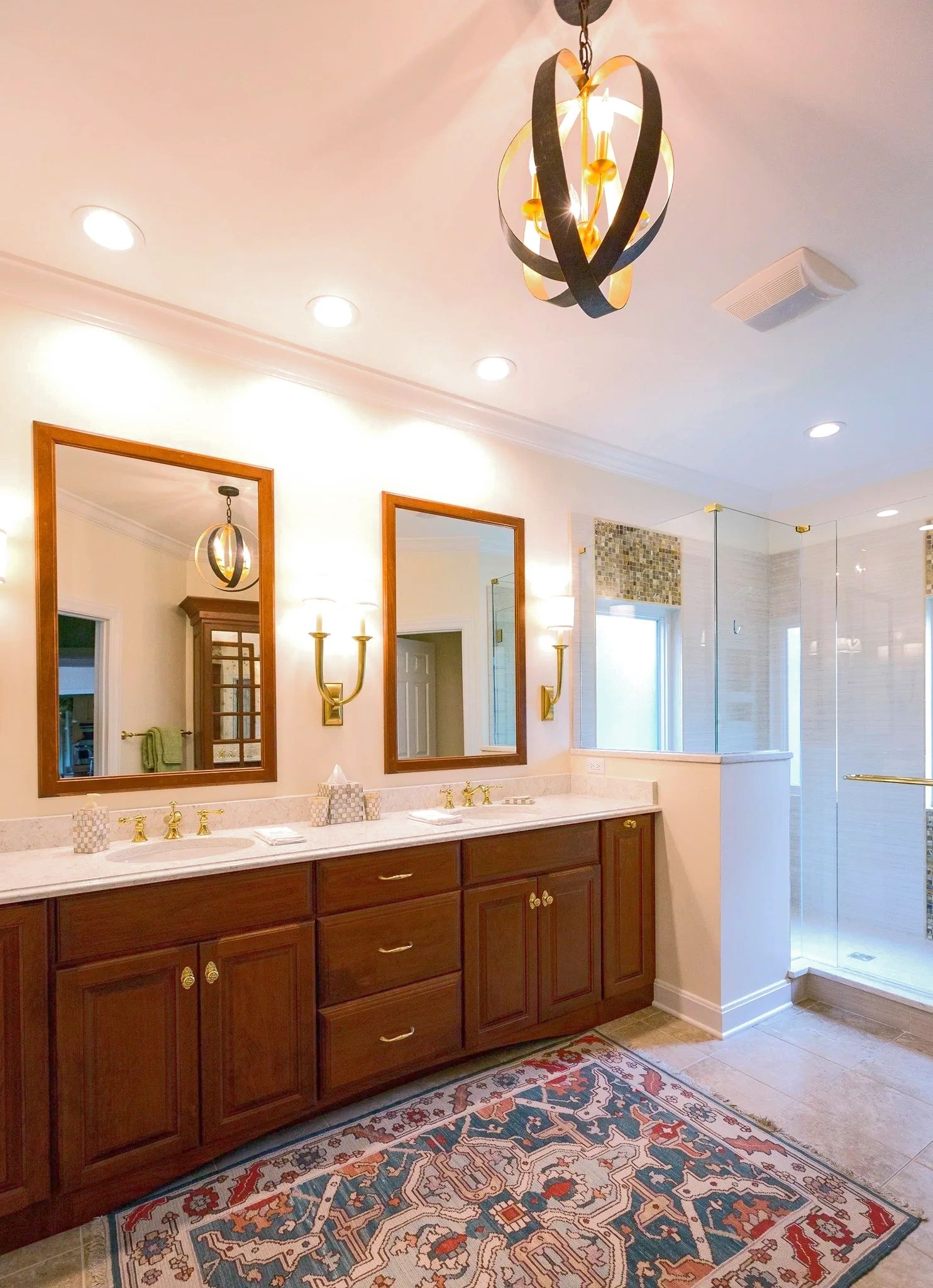 Elegant bathroom with double vanity and glass shower.