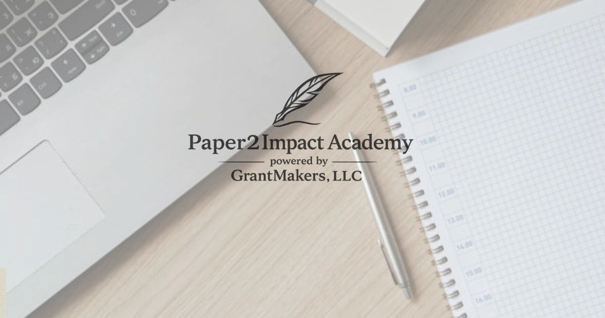 Paper2Impact Academy logo over a workspace with a laptop, notebook, and pen.