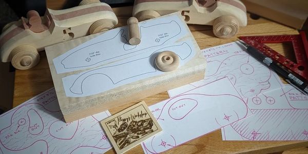Patterns of race cars and blocks of wood ready for cutting