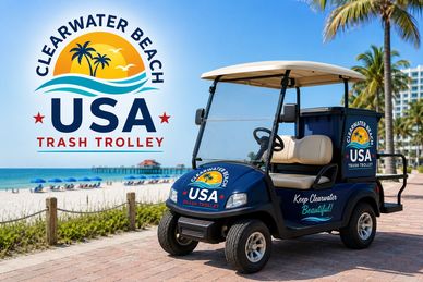 A trash trolley at Clearwater Beach with a scenic beach background.