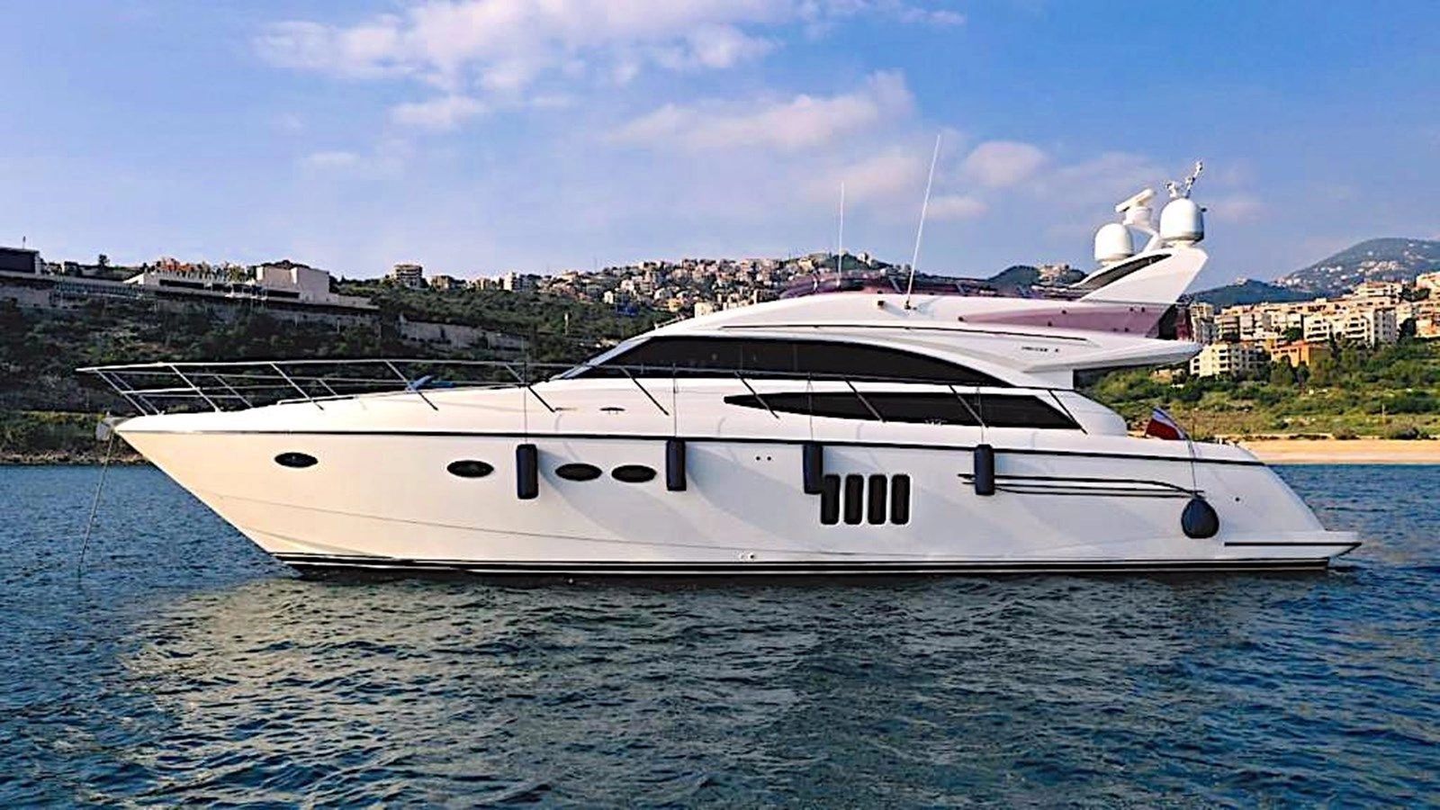 A white luxury yacht on the water.