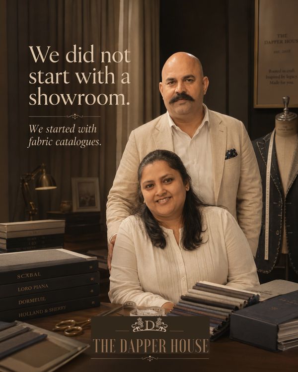 A couple showcasing fabric catalogues at The Dapper House.