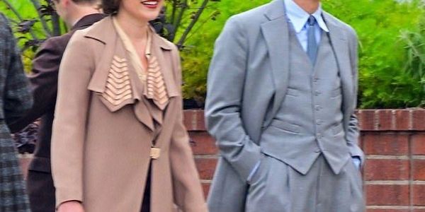 bespoke long jacket for a woman and a bespoke 3 piece suit for a man