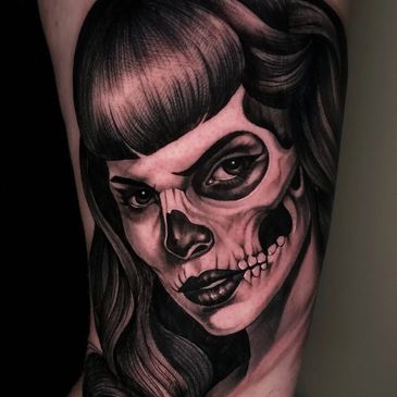 Black and Grey portrait tattoo of Betty Page.
