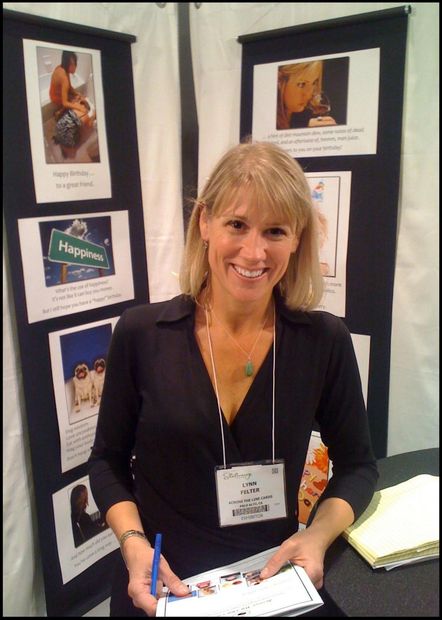 Photo of Lynn Felter.  Photo of Lynn Bergeron Felter working with Across The Line at tradeshow.