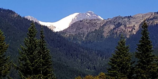 Peek view of Mt Rainer from Arbor of Nisqually Winds Mountain House