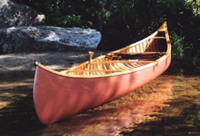 paddling a wood canvas canoe