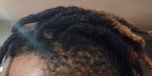 man with locs done by herbalist blends in Roswell Georgia