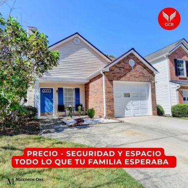 Casa familiar con garaje y jardín.