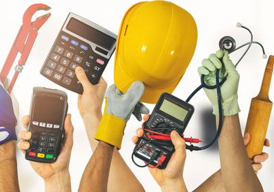 Various hands holding tools symbolizing different professions.