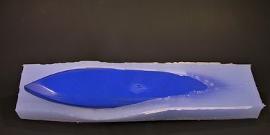 Cold cast bronze removing kayak from mold