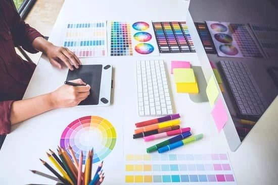 Person working with color design tools at a desk.