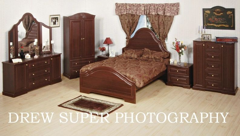 Classic wooden bedroom set with bed, dresser, and wardrobe.