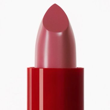 Close-up of a pink lipstick in a red tube.