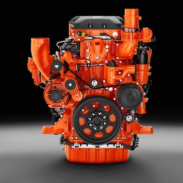 Bright orange industrial engine with black components isolated on a dark gradient background.